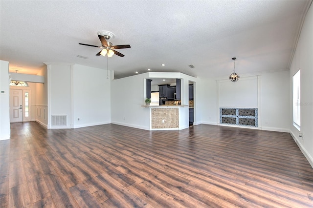 10505 Goldwater Ln, Riverview, FL 33578 - unfurnished living room featuring plenty of natural light, a ceiling fan, dark wood-type flooring, and a textured ceiling