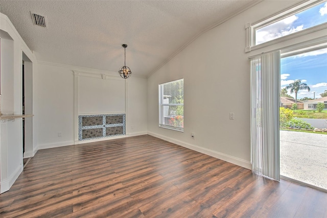 10505 Goldwater Ln, Riverview, FL 33578 - unfurnished dining area featuring a textured ceiling, vaulted ceiling, and dark wood-style floors