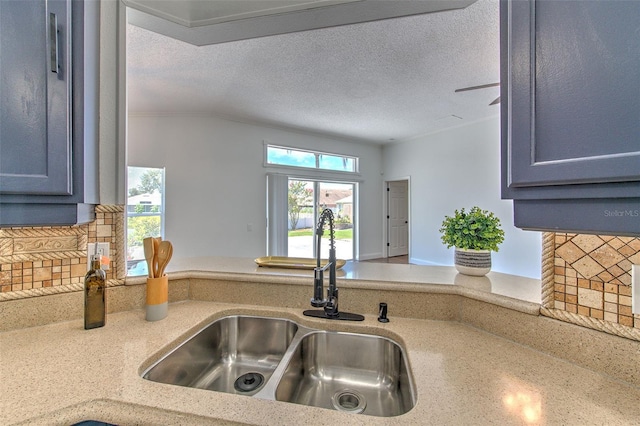 10505 Goldwater Ln, Riverview, FL 33578 - kitchen with backsplash and a textured ceiling