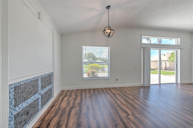 10505 Goldwater Ln, Riverview, FL 33578 - unfurnished dining area featuring a textured ceiling, dark wood-style flooring, a chandelier, vaulted ceiling, and ornamental molding