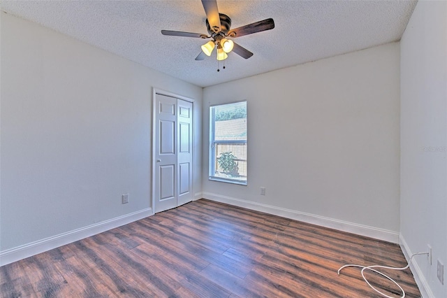 10505 Goldwater Ln, Riverview, FL 33578 - spare room featuring dark wood-type flooring, a textured ceiling, and ceiling fan