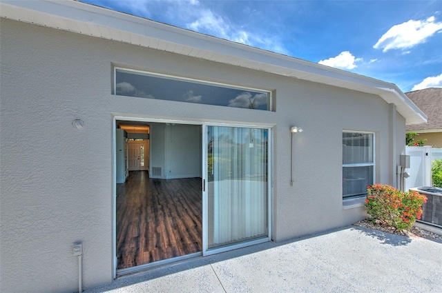 10505 Goldwater Ln, Riverview, FL 33578 - entrance to property with stucco siding and a patio