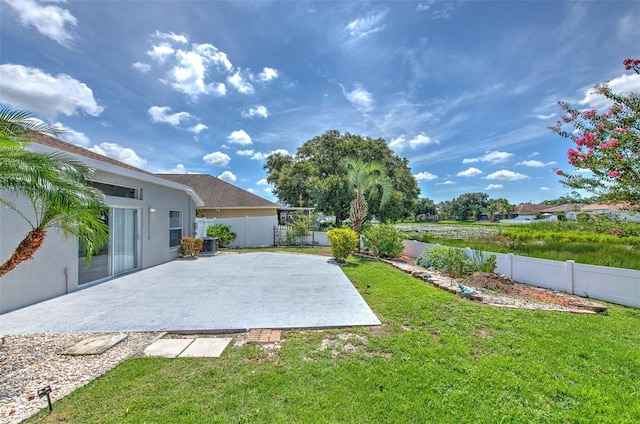 10505 Goldwater Ln, Riverview, FL 33578 - fenced backyard with a patio area