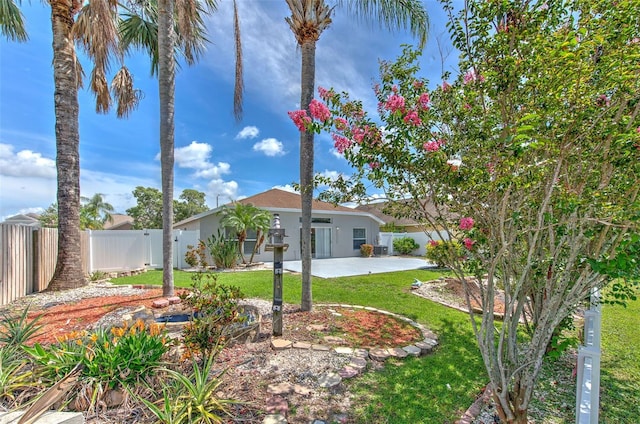 10505 Goldwater Ln, Riverview, FL 33578 - view of front of home with a fenced backyard, a patio, and stucco siding