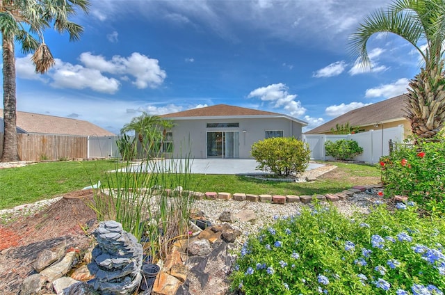 10505 Goldwater Ln, Riverview, FL 33578 - back of property with stucco siding, a fenced backyard, a patio area, and a gate