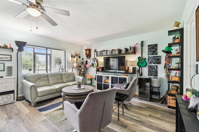 549 Walden Ct, Dunedin, FL 34698 - living room with a textured ceiling, wood finished floors, and ceiling fan