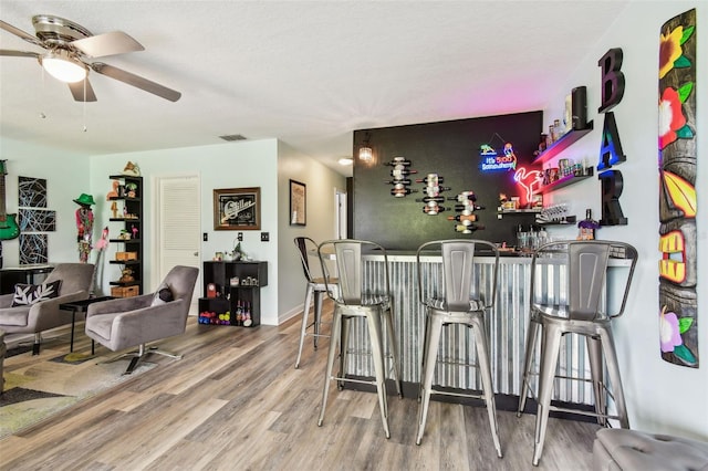 549 Walden Ct, Dunedin, FL 34698 - indoor bar featuring ceiling fan and wood finished floors