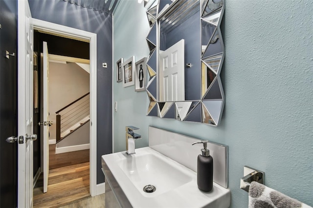 549 Walden Ct, Dunedin, FL 34698 - bathroom featuring wood finished floors and a sink