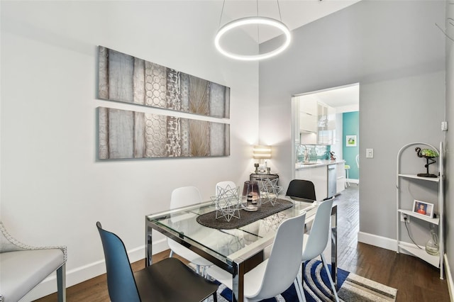 549 Walden Ct, Dunedin, FL 34698 - dining area with wood finished floors and a towering ceiling