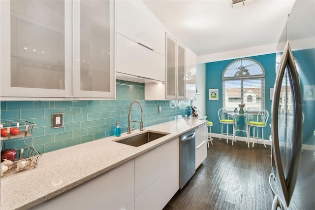 549 Walden Ct, Dunedin, FL 34698 - kitchen with appliances with stainless steel finishes, white cabinetry, modern cabinets, and dark wood finished floors