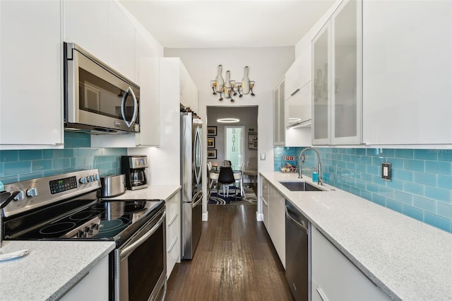 549 Walden Ct, Dunedin, FL 34698 - kitchen featuring stainless steel appliances, white cabinets, dark wood-style floors, and glass insert cabinets