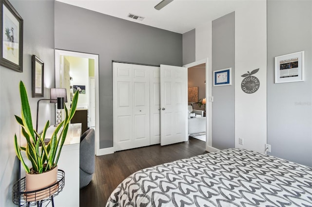 549 Walden Ct, Dunedin, FL 34698 - bedroom with dark wood-type flooring, a closet, ensuite bathroom, and a towering ceiling
