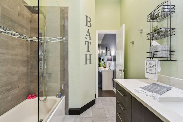 549 Walden Ct, Dunedin, FL 34698 - full bath with vanity, bath / shower combo with glass door, and tile patterned floors