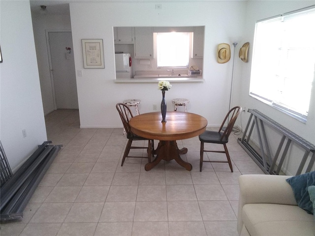 390 301st Blvd W Unit 8D, Bradenton, FL 34205 - dining room with light tile patterned floors