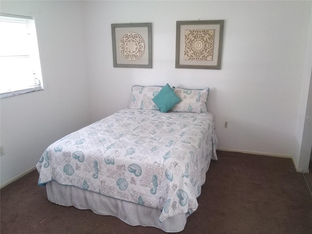 390 301st Blvd W Unit 8D, Bradenton, FL 34205 - bedroom featuring carpet floors and baseboards
