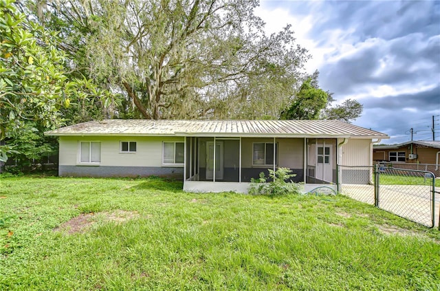 37740 Waverly Ave, Zephyrhills, FL 33542 - back of property with a sunroom and a metal roof