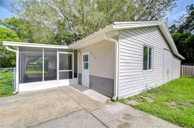 37740 Waverly Ave, Zephyrhills, FL 33542 - view of home's exterior with a sunroom and a patio area