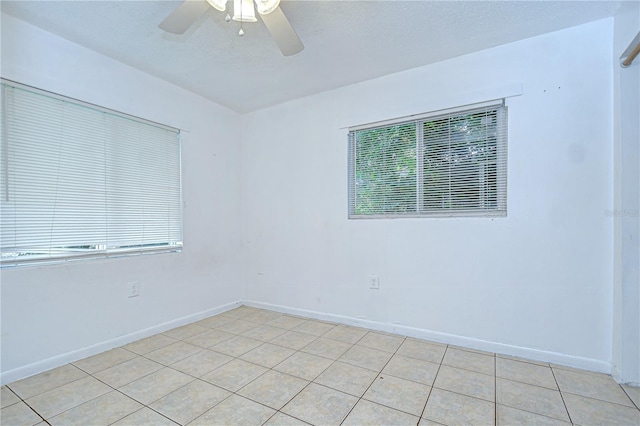 37740 Waverly Ave, Zephyrhills, FL 33542 - spare room with ceiling fan and light tile patterned flooring