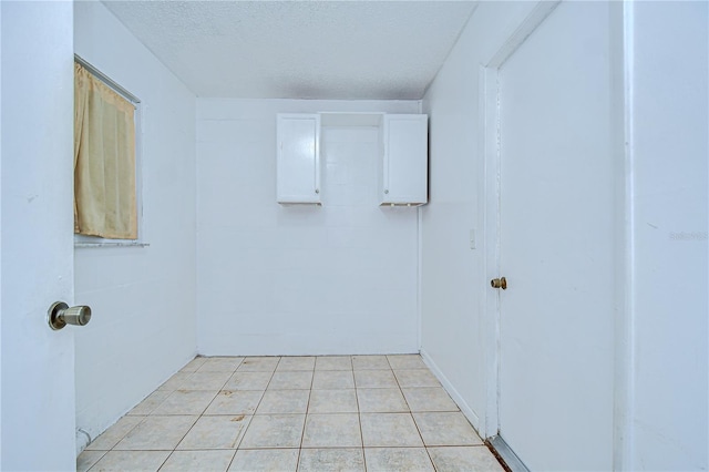 37740 Waverly Ave, Zephyrhills, FL 33542 - unfurnished room with a textured ceiling and light tile patterned floors