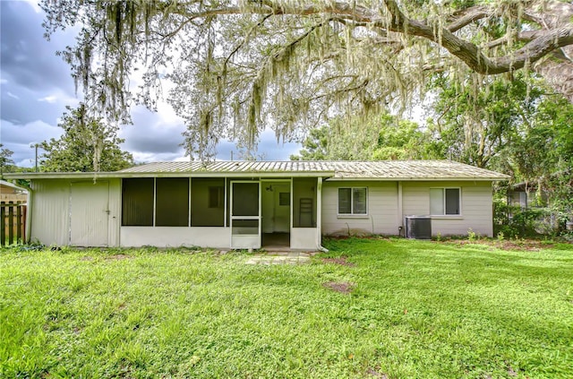 37740 Waverly Ave, Zephyrhills, FL 33542 - rear view of house featuring a sunroom and a metal roof