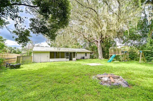 37740 Waverly Ave, Zephyrhills, FL 33542 - view of yard with a sunroom and a playground