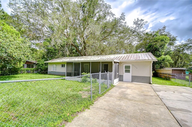 37740 Waverly Ave, Zephyrhills, FL 33542 - single story home with a metal roof, concrete driveway, and view of wooded area