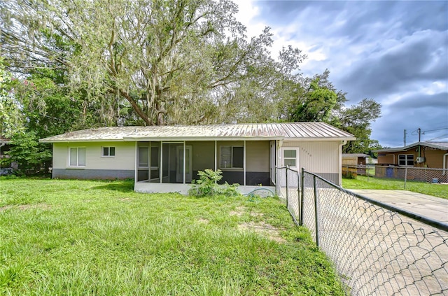 37740 Waverly Ave, Zephyrhills, FL 33542 - rear view of property featuring a sunroom and a metal roof