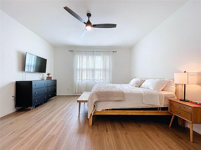 8214 Wheat Stone Dr, Zephyrhills, FL 33540 - bedroom featuring light wood-type flooring and a ceiling fan