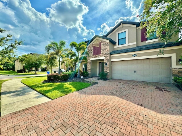 19502 Sea Myrtle Way, Tampa, FL 33647 - view of front of house with stone siding, stucco siding, an attached garage, decorative driveway, and a front lawn