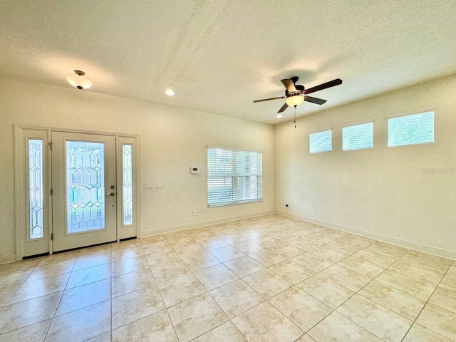 19502 Sea Myrtle Way, Tampa, FL 33647 - foyer entrance featuring a textured ceiling, a ceiling fan, light tile patterned floors, and recessed lighting