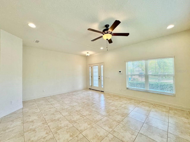 19502 Sea Myrtle Way, Tampa, FL 33647 - empty room featuring recessed lighting, a ceiling fan, light tile patterned floors, french doors, and a textured ceiling