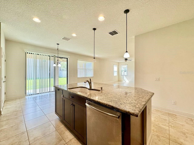 19502 Sea Myrtle Way, Tampa, FL 33647 - kitchen with dishwasher, a textured ceiling, an island with sink, light stone countertops, and a ceiling fan