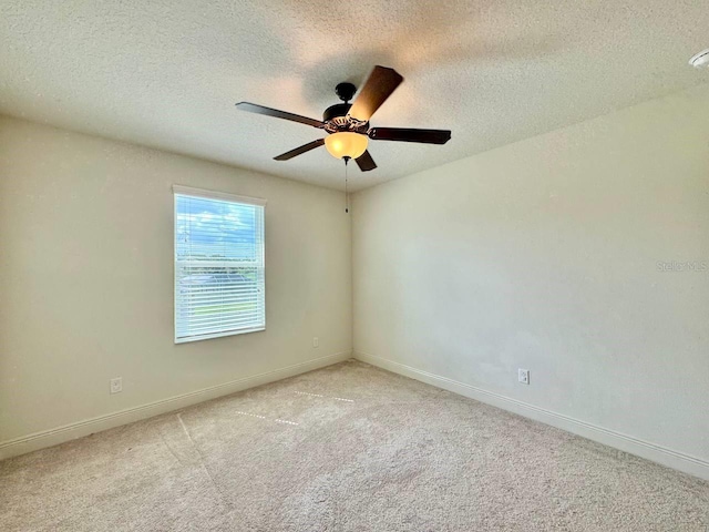 19502 Sea Myrtle Way, Tampa, FL 33647 - unfurnished room with light carpet, a textured ceiling, and ceiling fan