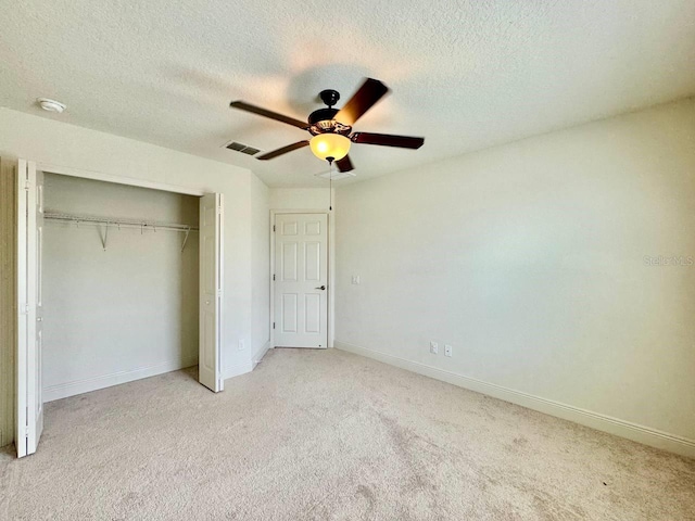 19502 Sea Myrtle Way, Tampa, FL 33647 - unfurnished bedroom with carpet floors, a closet, ceiling fan, and a textured ceiling