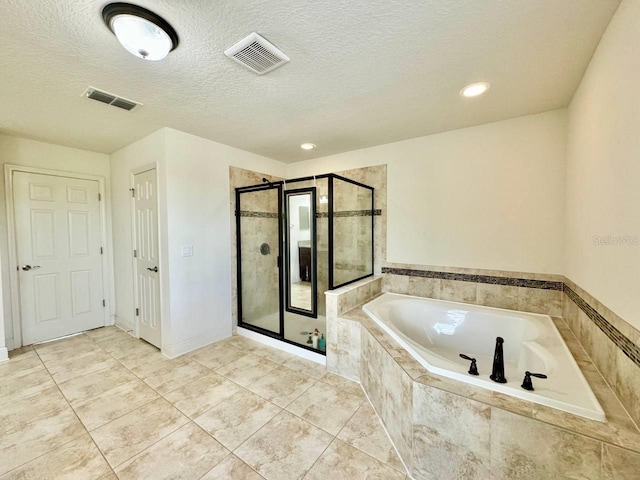 19502 Sea Myrtle Way, Tampa, FL 33647 - bathroom featuring a stall shower, a garden tub, tile patterned flooring, a textured ceiling, and recessed lighting