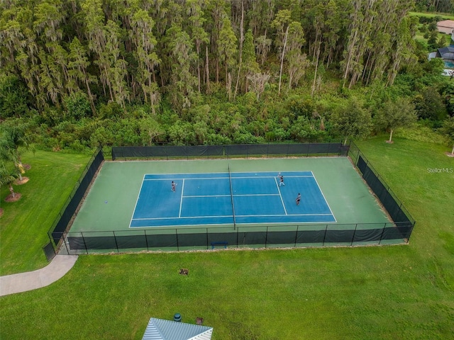 19502 Sea Myrtle Way, Tampa, FL 33647 - view of tennis court with a view of trees