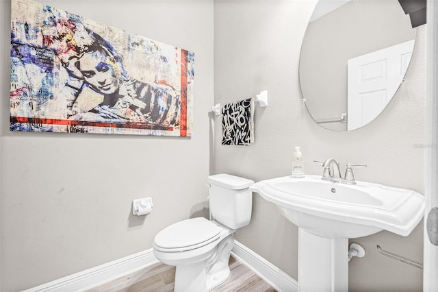 9237 Fox Sparrow Rd, Tampa, FL 33626 - half bathroom with toilet and wood finished floors