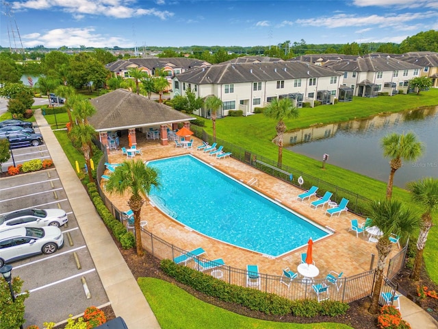 9237 Fox Sparrow Rd, Tampa, FL 33626 - community pool featuring a residential view, a patio area, and a water view