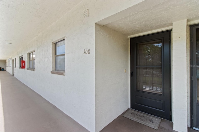 5920 80th St N Unit 308, Saint Petersburg, FL 33709 - property entrance with stucco siding