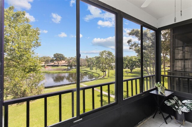 5920 80th St N Unit 308, Saint Petersburg, FL 33709 - sunroom with a water view, tile patterned flooring, and healthy amount of natural light