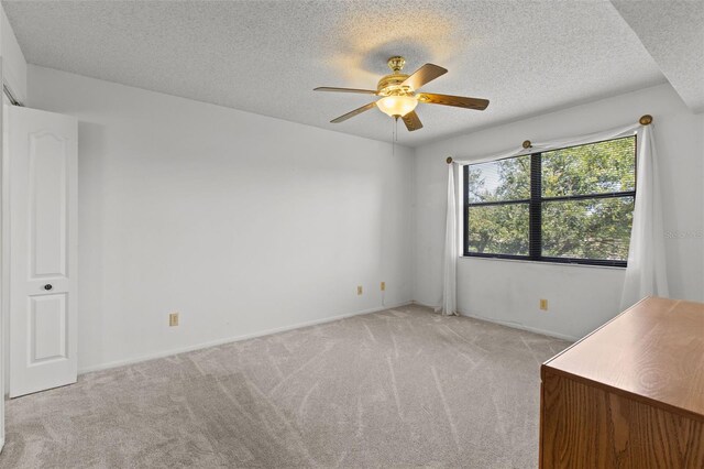 5920 80th St N Unit 308, Saint Petersburg, FL 33709 - carpeted spare room with ceiling fan and a textured ceiling