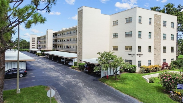 5920 80th St N Unit 308, Saint Petersburg, FL 33709 - view of apartment building / complex with uncovered parking