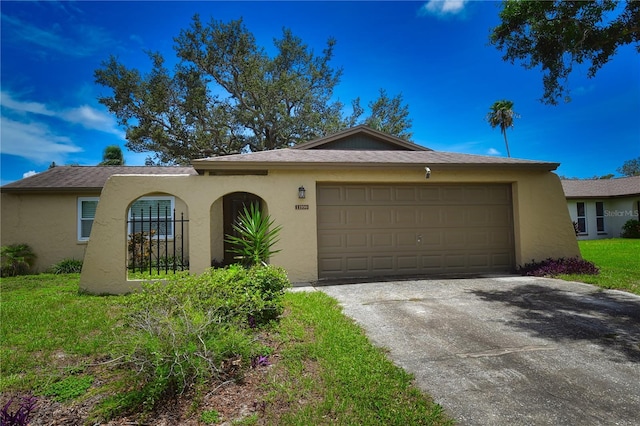 11990 104th Ave, Largo, FL 33778 - view of front of property featuring an attached garage, driveway, and stucco siding