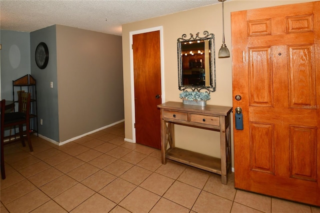 11990 104th Ave, Largo, FL 33778 - entrance foyer featuring light tile patterned floors and a textured ceiling