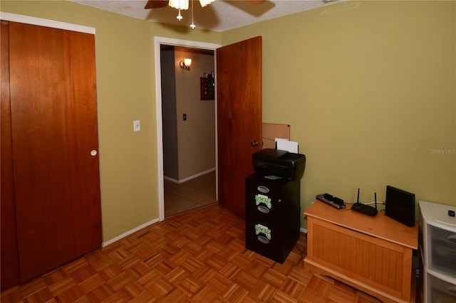 11990 104th Ave, Largo, FL 33778 - bedroom featuring ceiling fan, a textured ceiling, and an office area