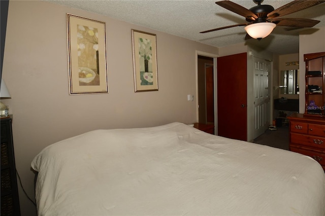 11990 104th Ave, Largo, FL 33778 - bedroom featuring a textured ceiling and ceiling fan