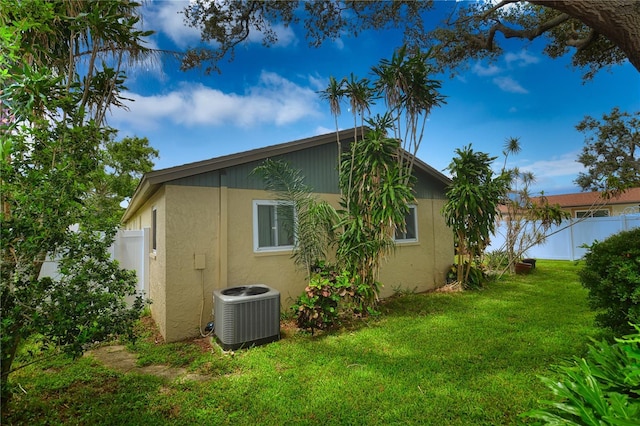 11990 104th Ave, Largo, FL 33778 - view of home's exterior featuring a central air condition unit and stucco siding