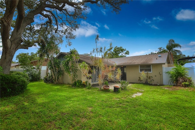 11990 104th Ave, Largo, FL 33778 - rear view of property featuring stucco siding