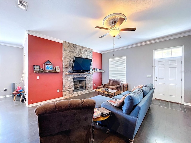 3108 Tom Matthews Rd, Lakeland, FL 33810 - living area featuring a ceiling fan, ornamental molding, dark wood-style floors, and a stone fireplace
