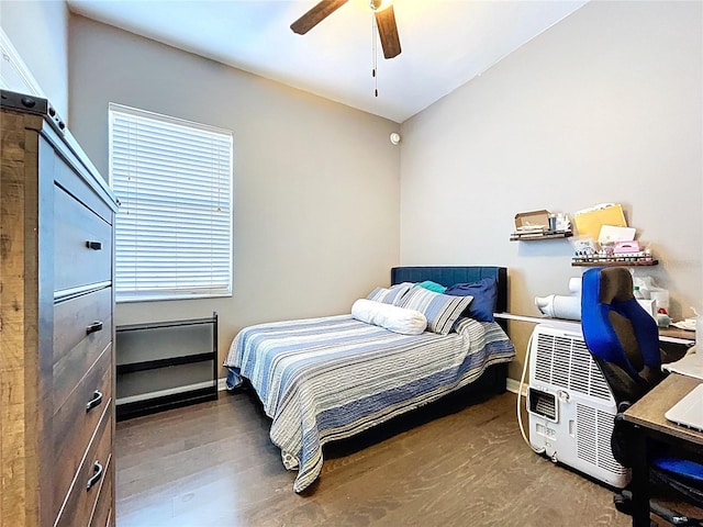 3108 Tom Matthews Rd, Lakeland, FL 33810 - bedroom with wood finished floors, ceiling fan, and an office area